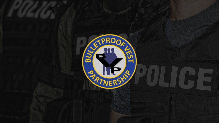 Image of Police in background with Bulletproof Vest Partnership Program BVP logo in center
